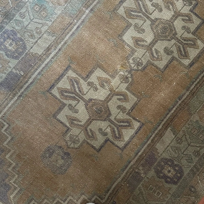 4 by 7 neutral Turkish area rug featuring a beautiful floral border and pops of lavendar and sky blue.