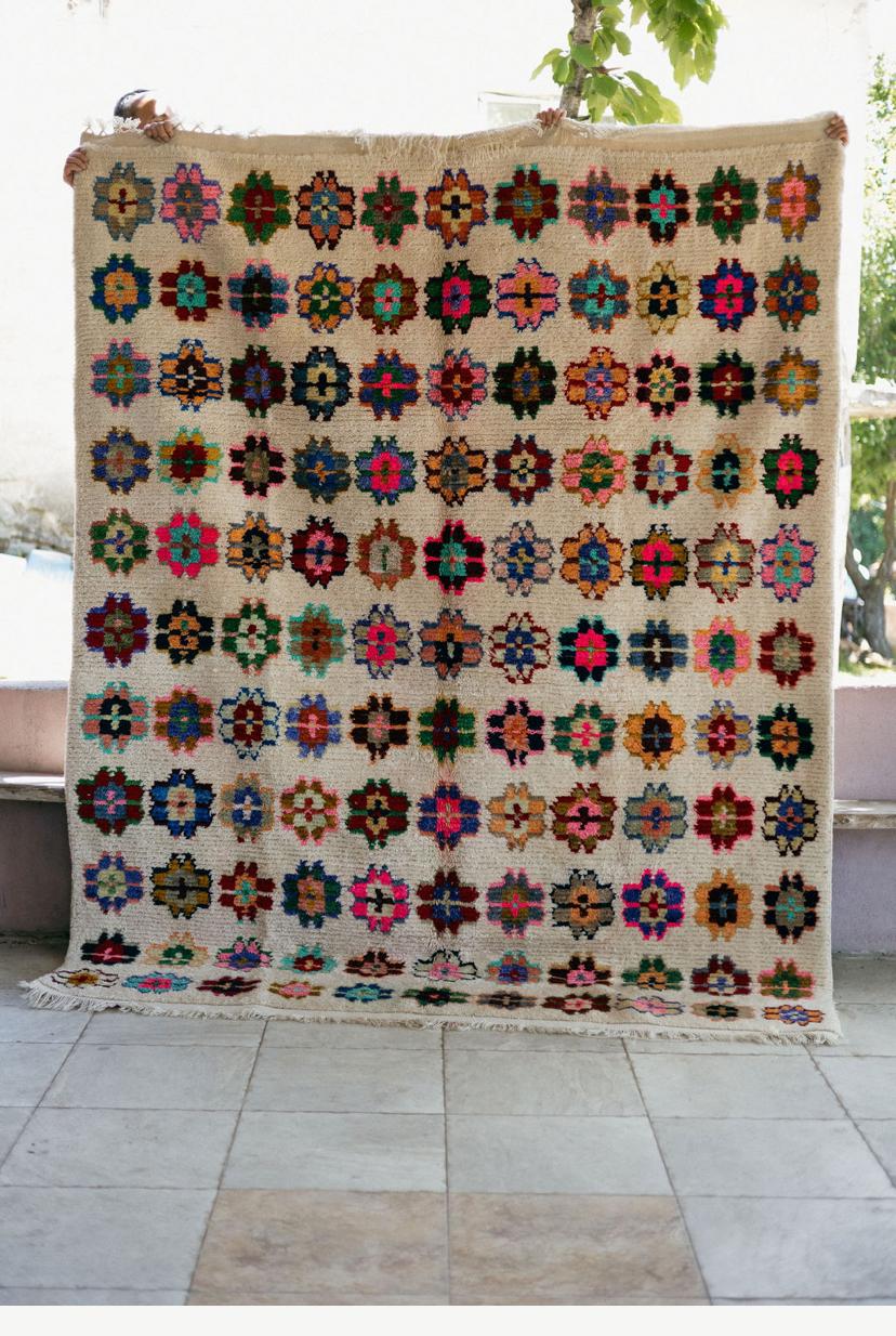 Colorful floral and geometric patterned rug