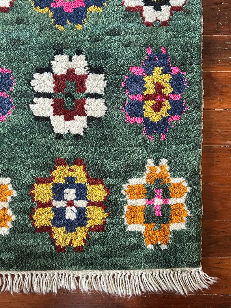 Decorative rug with geometric patterns on a wooden floor