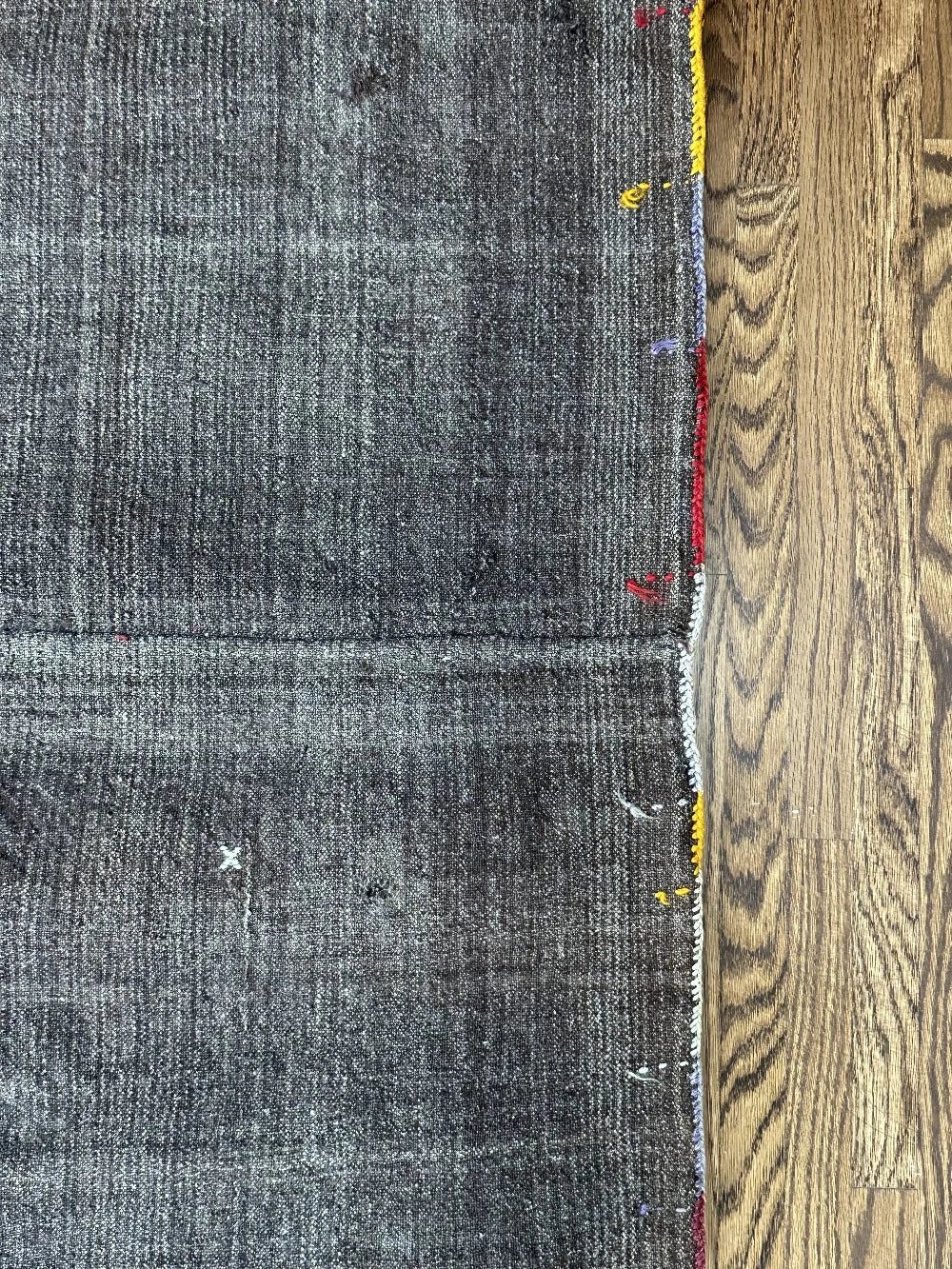 Mini Turkish Rug featuring pops of red and light blue with a repeating diamond pattern throughout