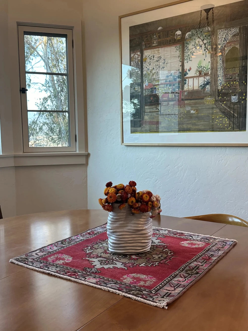 square mini red Turkish rug with a rose patterned border and large geometric medallion center