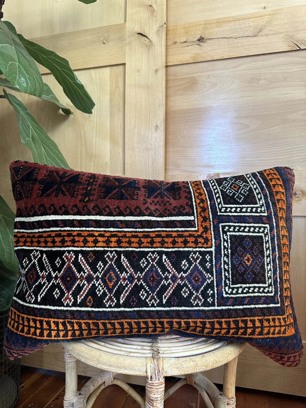 16 x 24 dark purple and navy blue lumbar pillow featuring geometric pattern