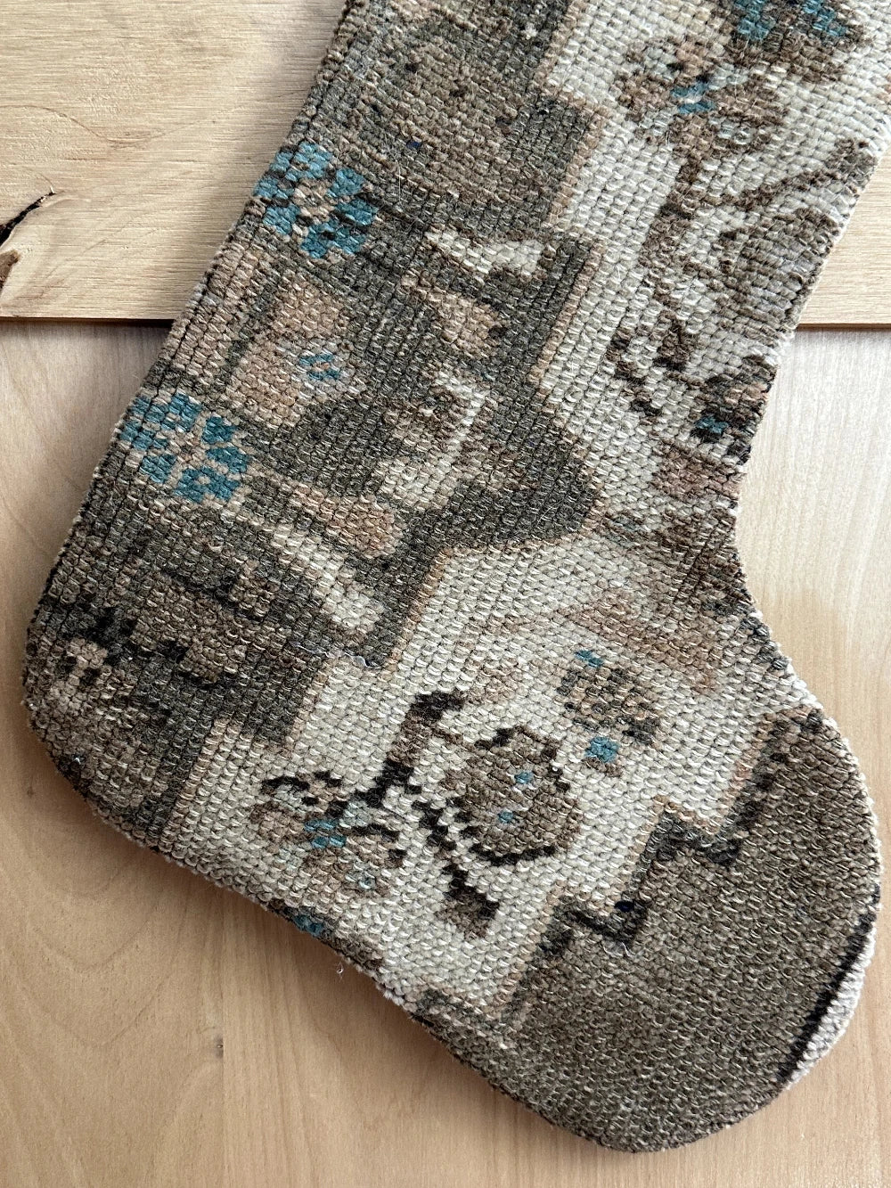 handmade Turkish rug Christmas stocking featuring a neutral floral pattern with hints of baby blue flowers