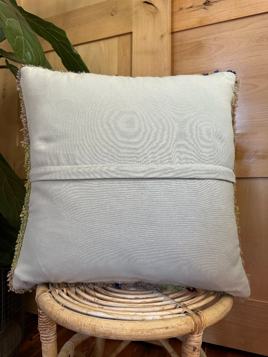 Hand-knotted, shaggy purple and green Turkish throw pillow, 20x20 inches, wool front with geometric design and pops of blue and maroon, cotton backing—boho home decor.