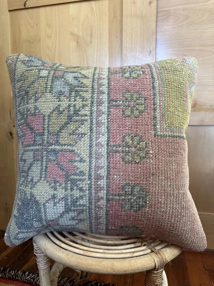 18 by 18 neutral floral pile pillow with pops of light pink, yellow and cream
