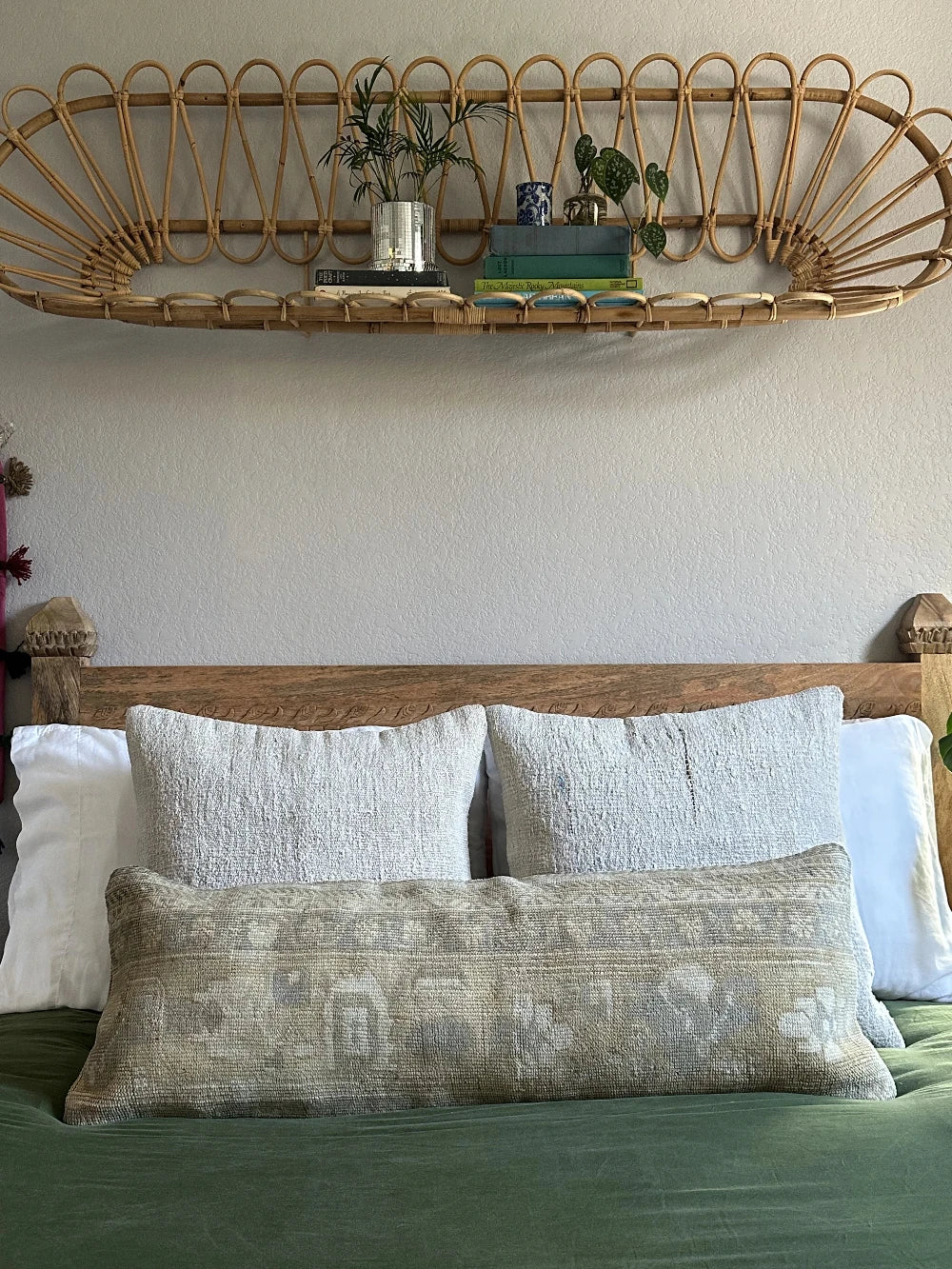 12 by 36 neutral lumbar pillow featuring a geometric design and hints of lilac, tan and sand.