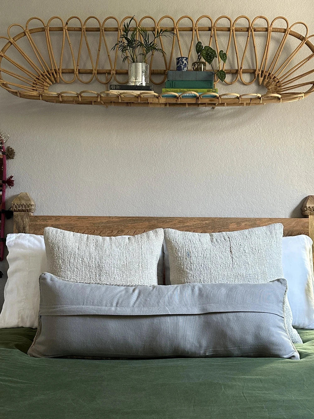 12 by 36 neutral lumbar pillow featuring a geometric design and hints of lilac, tan and sand.