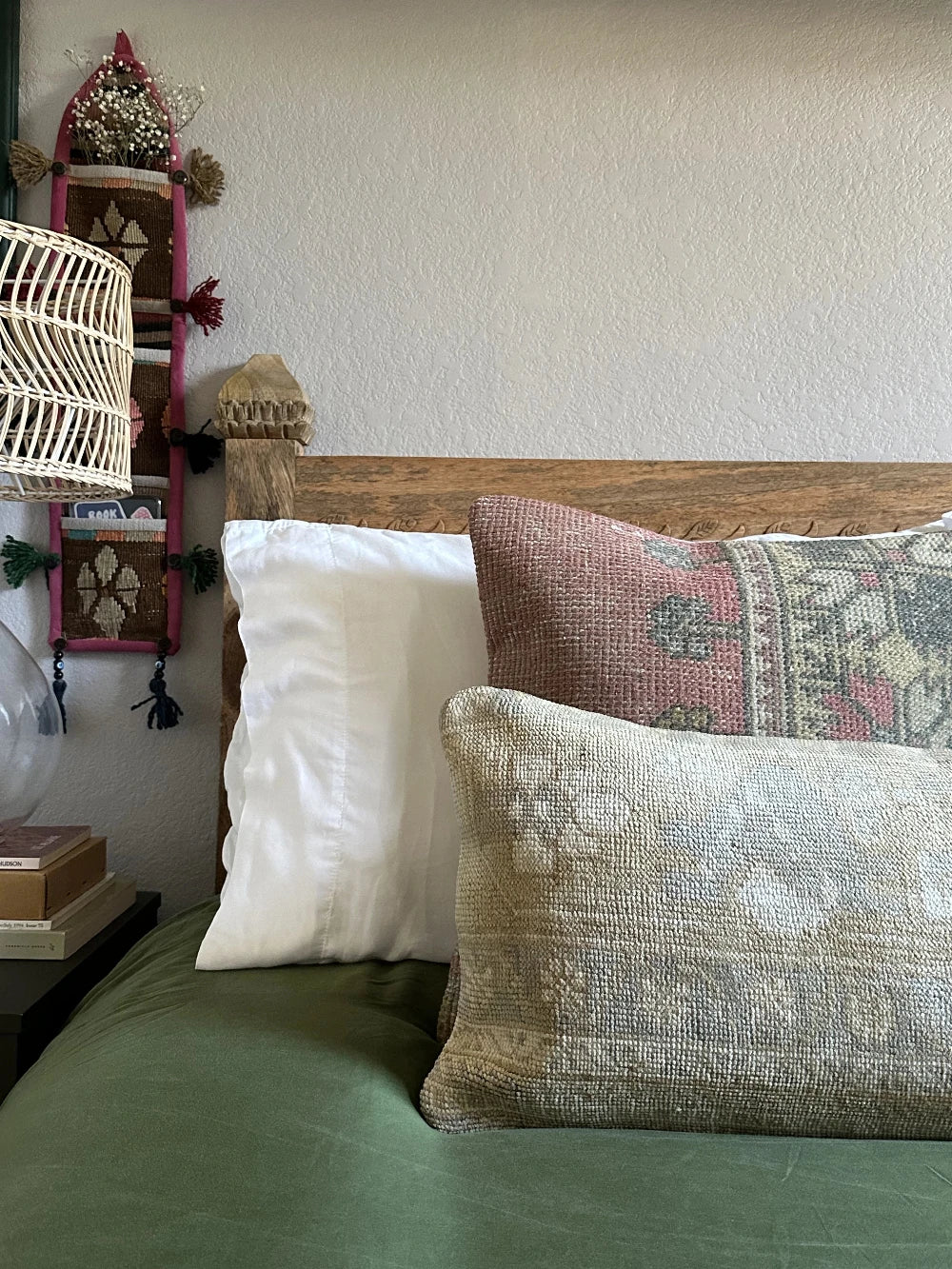 12 by 36 neutral lumbar pillow featuring a geometric design and hints of lilac, tan and sand.