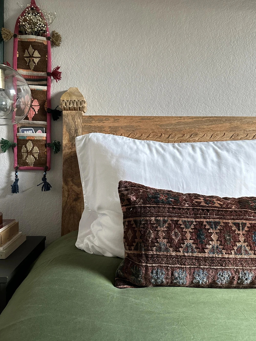 12 by 36 inch Turkish lumbar pillow insert featuring a velvet soft low pile and a maroon and navy geometric design throughout