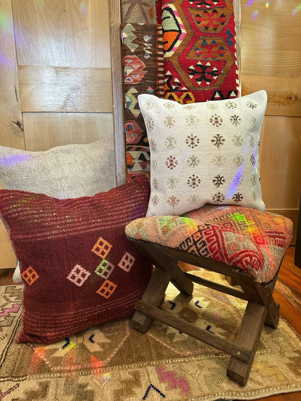 14 by 14 by 14 hand-carved Turkish tea house stools featuring recycled turkish rugs as seat covers
