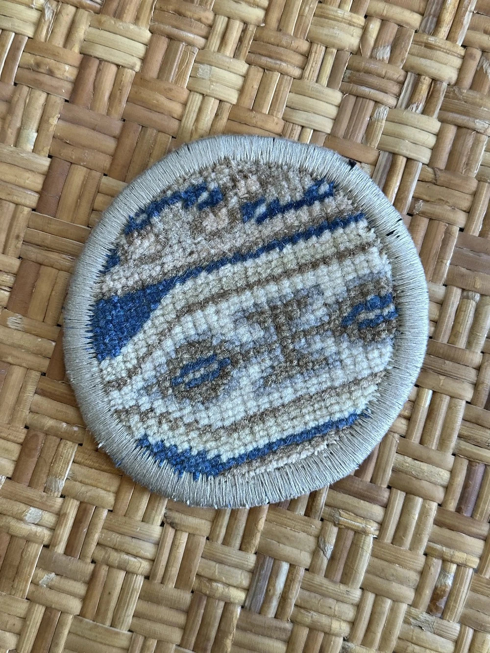 Handmade, unique 5 inch diameter turkish rug coaster set featuring navy and gold coloring and geometric pattern