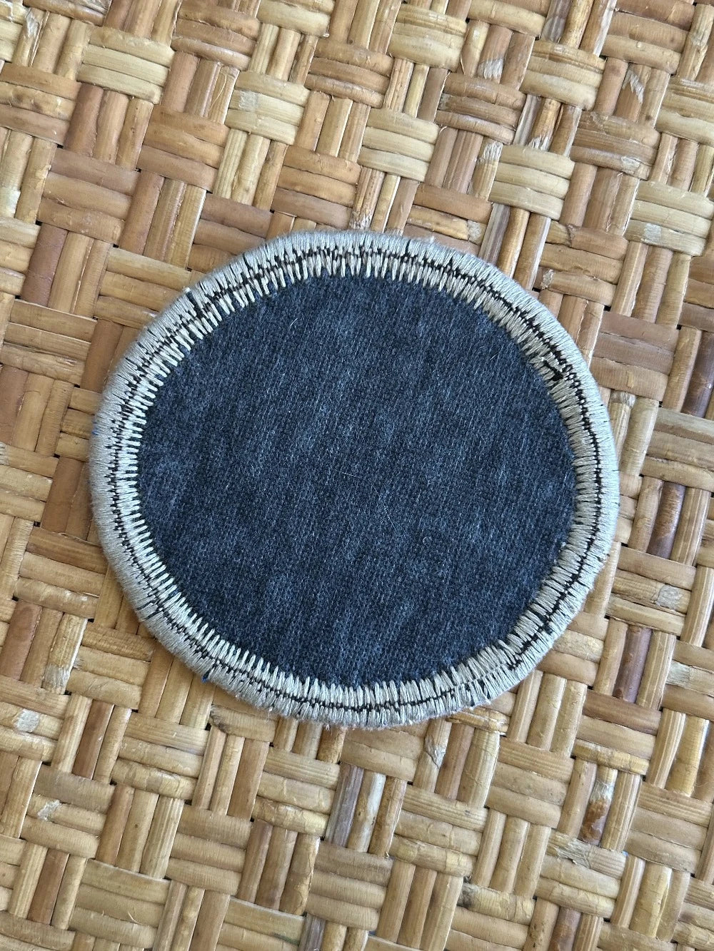 Handmade, unique 5 inch diameter turkish rug coaster set featuring navy and gold coloring and geometric pattern