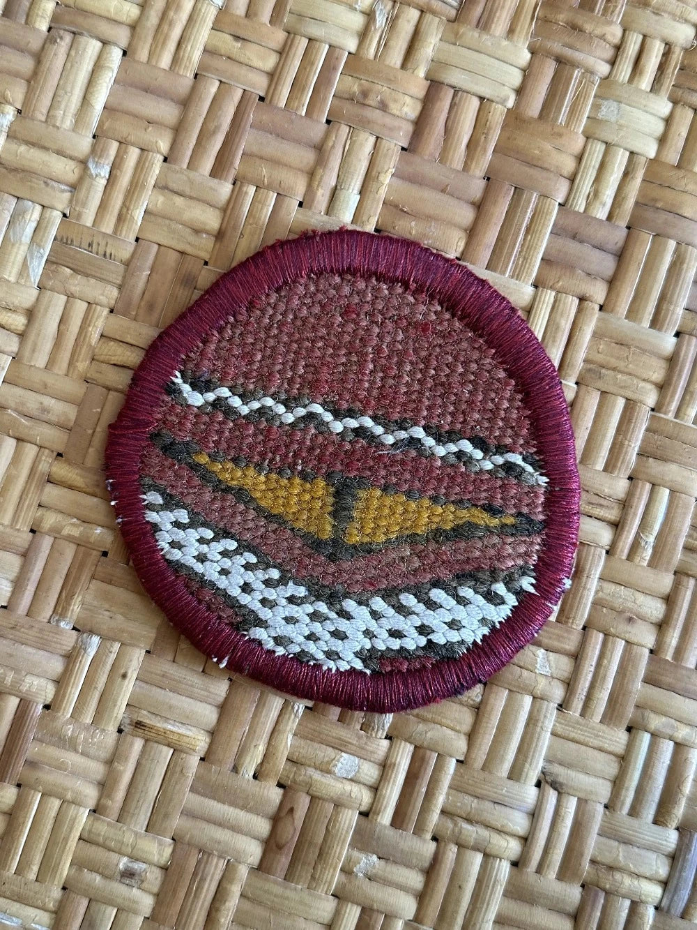 Turkish coaster set measuring 3.75 inches featuring a white and orange geometric print