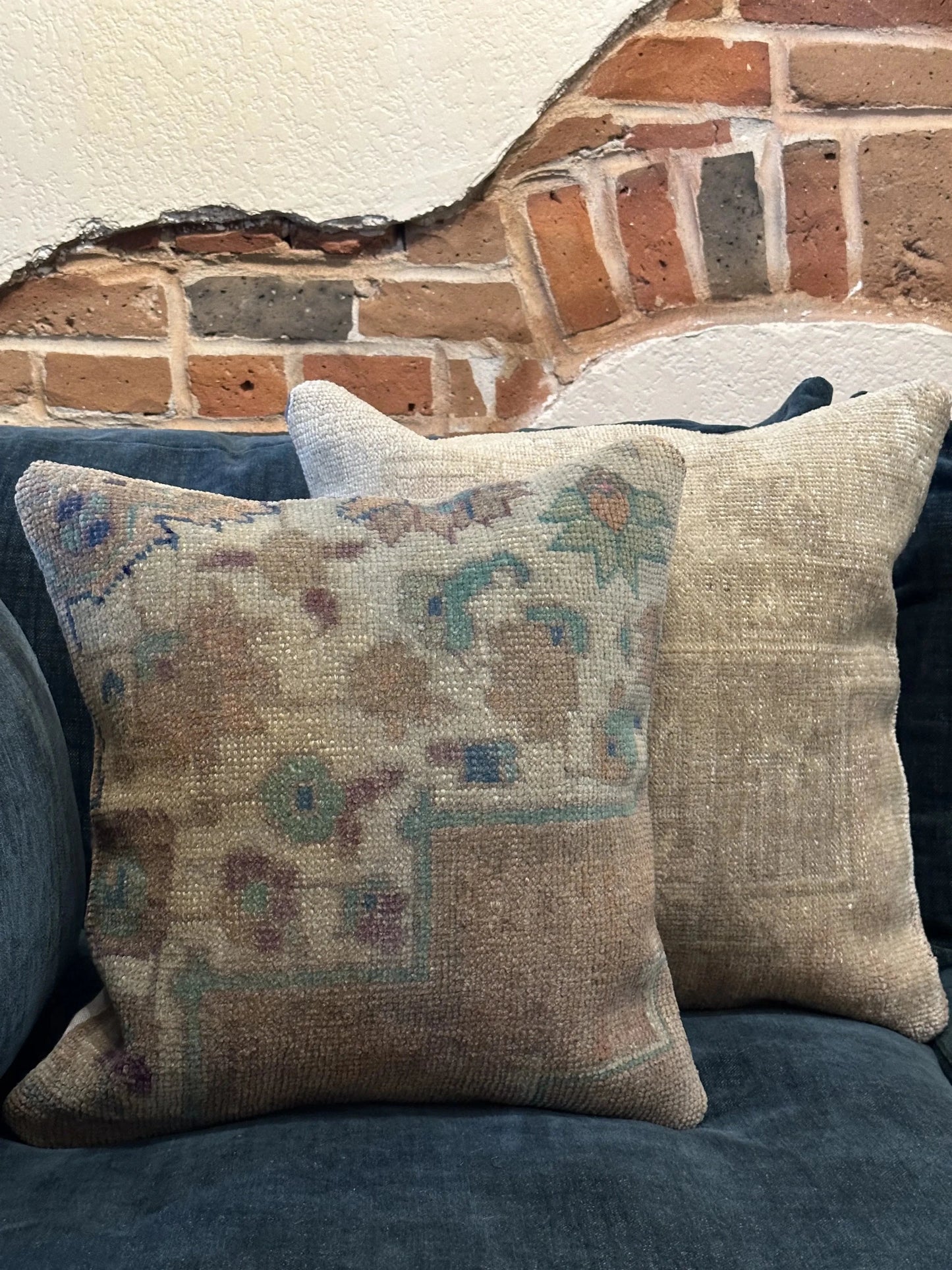 15 by 15 neutral Turkish throw pillow featuring soft pile and muted blue and white tones and a floral pattern upcycled from a Turkish rug