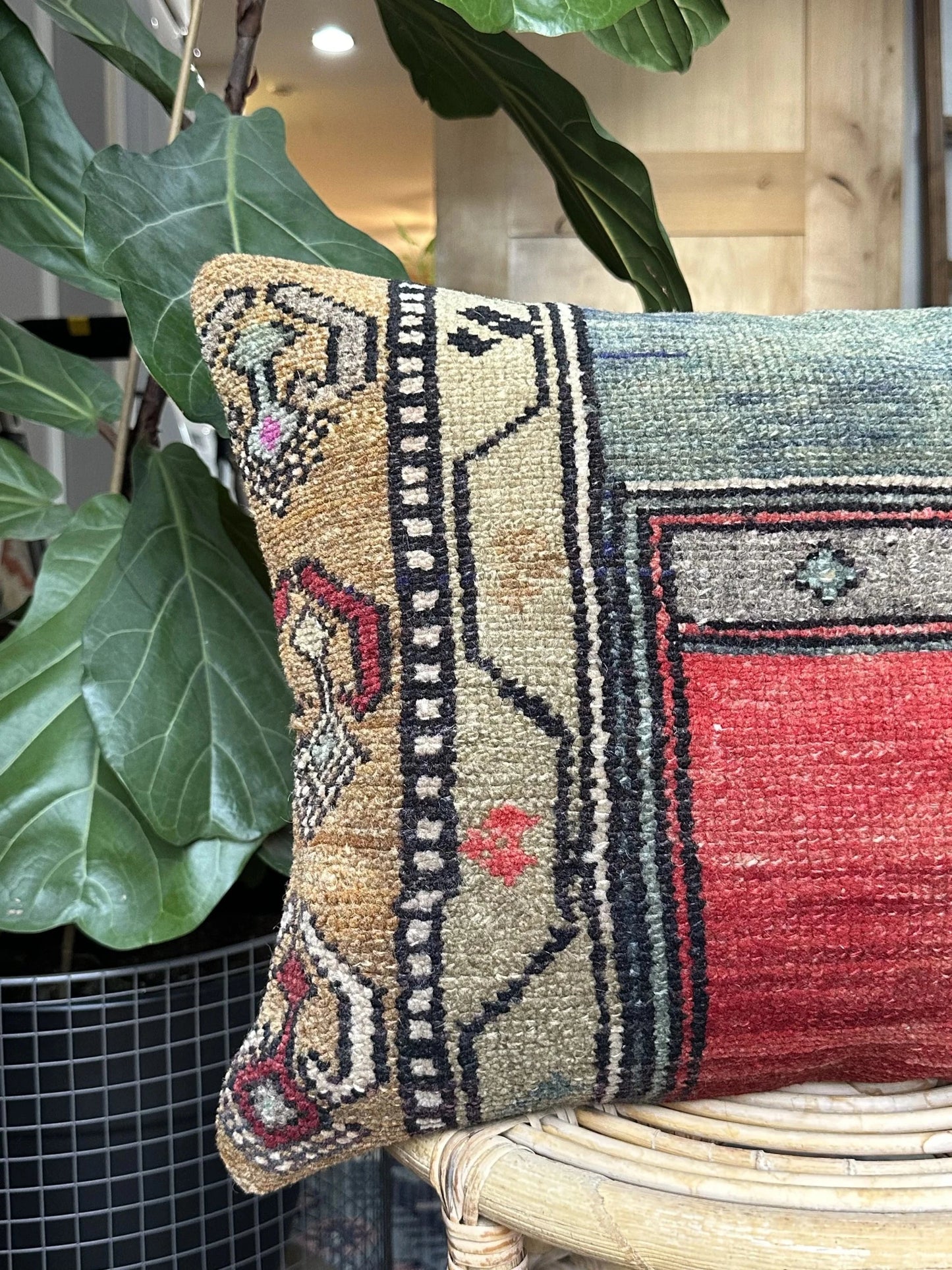 16 by 24 Turkish lumbar pillow featuring bright red coloring and accents of emerald and gold upcycled from a Turkish rug