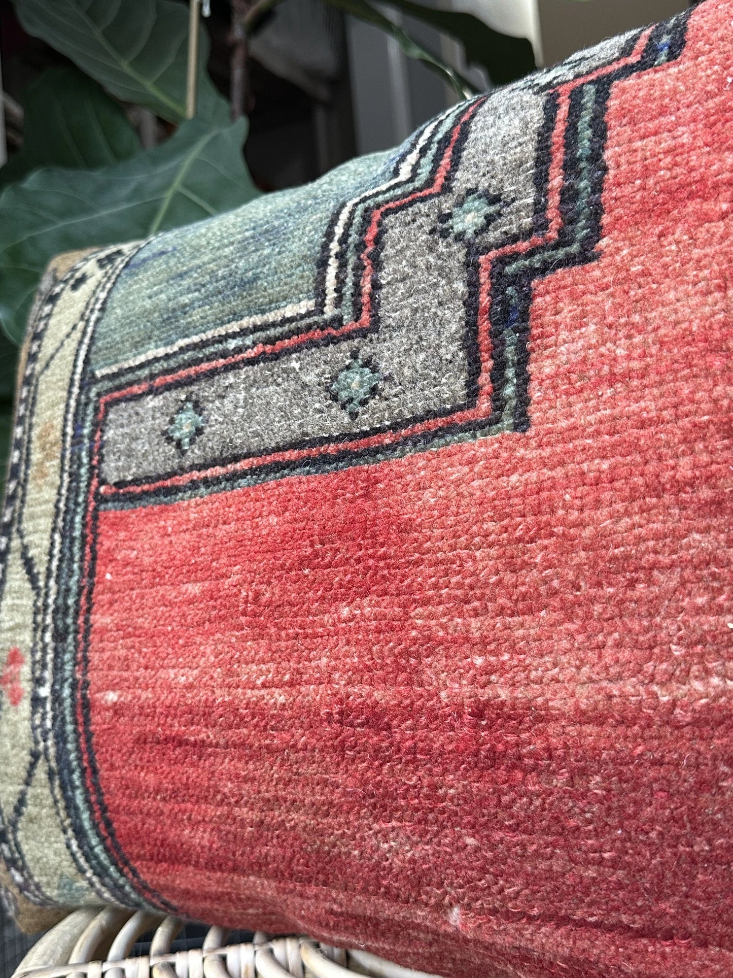 16 by 24 Turkish lumbar pillow featuring bright red coloring and accents of emerald and gold upcycled from a Turkish rug