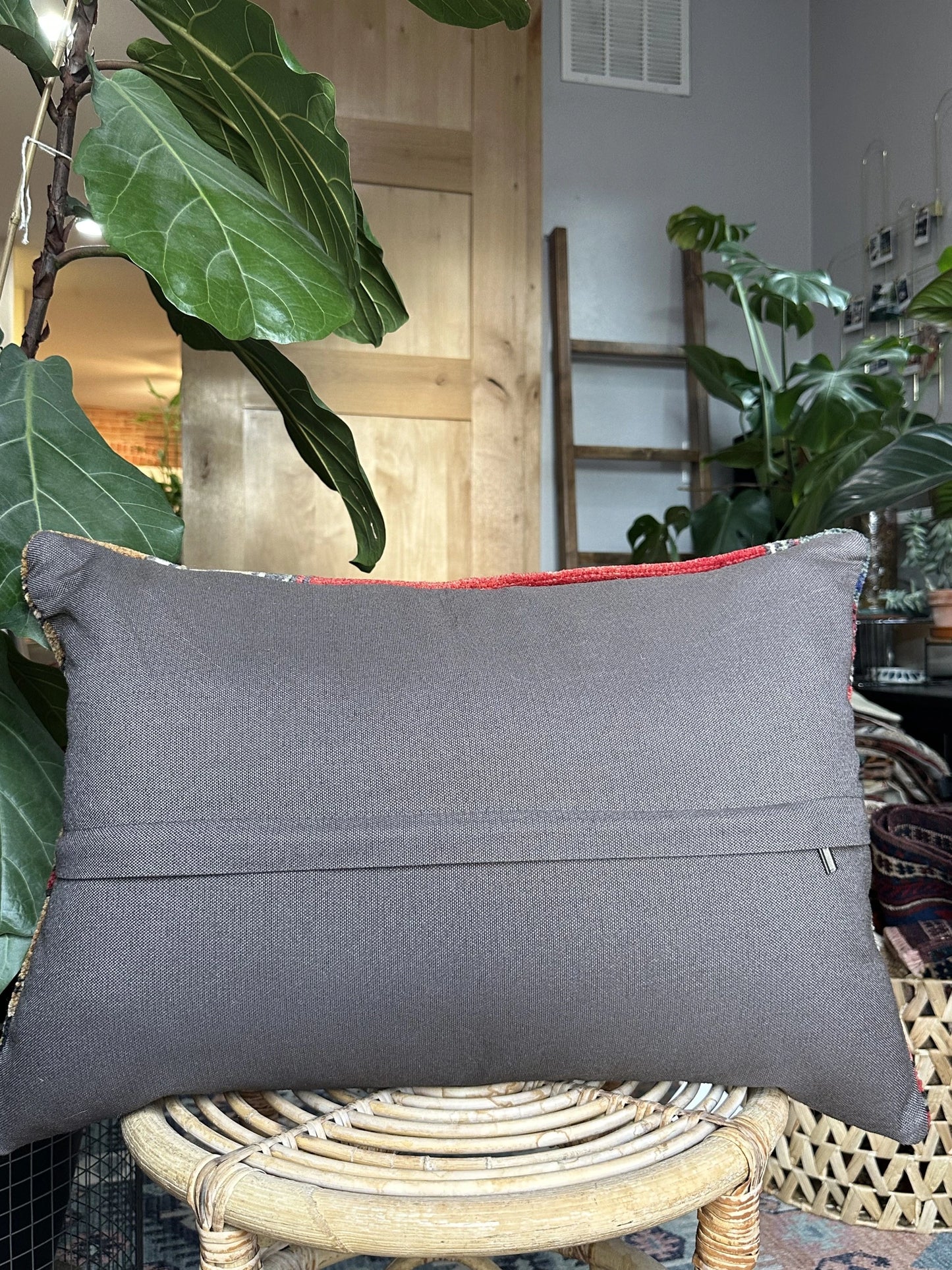 16 by 24 Turkish lumbar pillow featuring bright red coloring and accents of emerald and gold upcycled from a Turkish rug