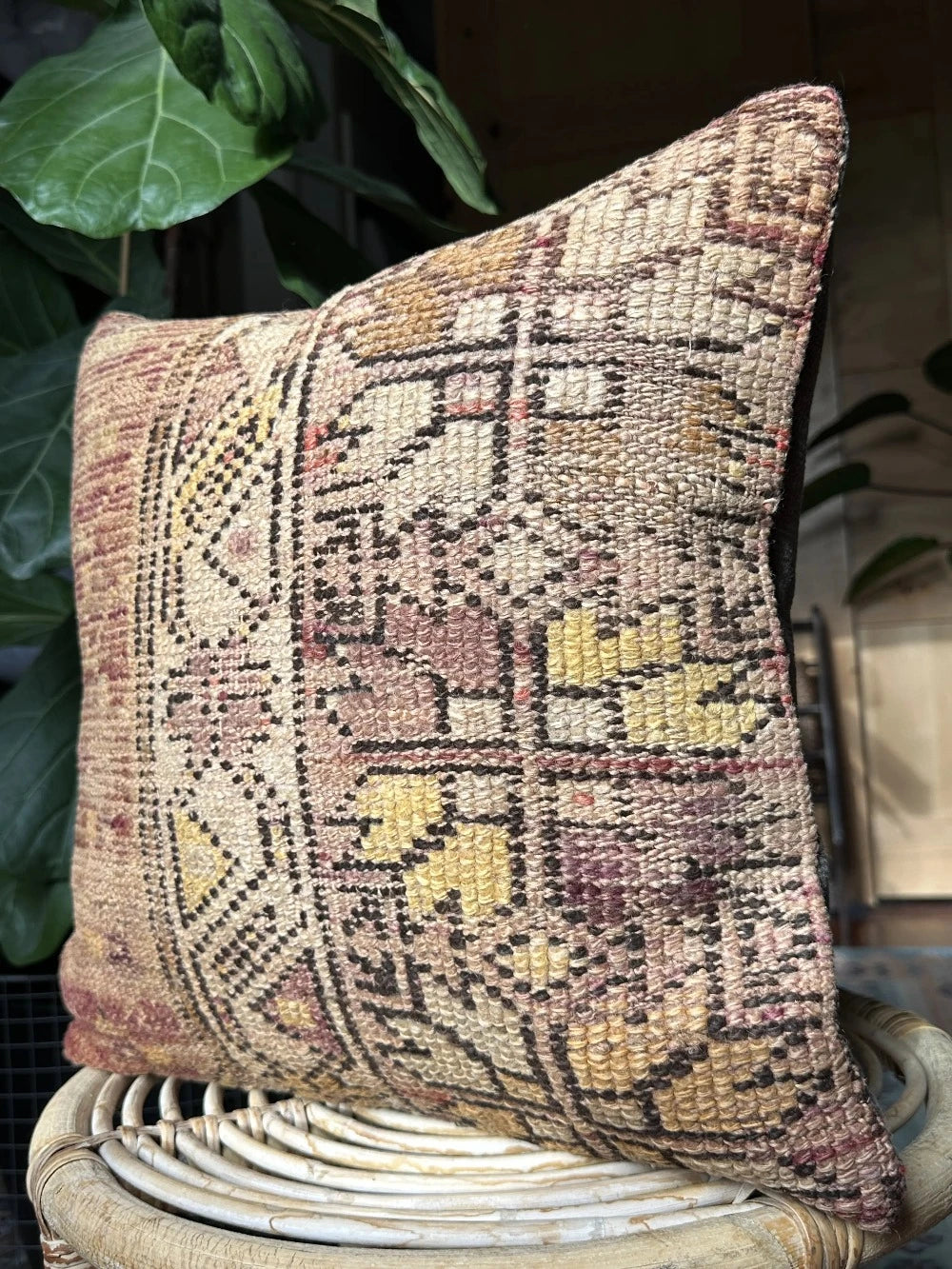 16 by 16 Turkish throw pillow featuring soft pile material and beautiful muted pink and yellow muted tones and a geometric pattern on one side upcycled from a Turkish rug