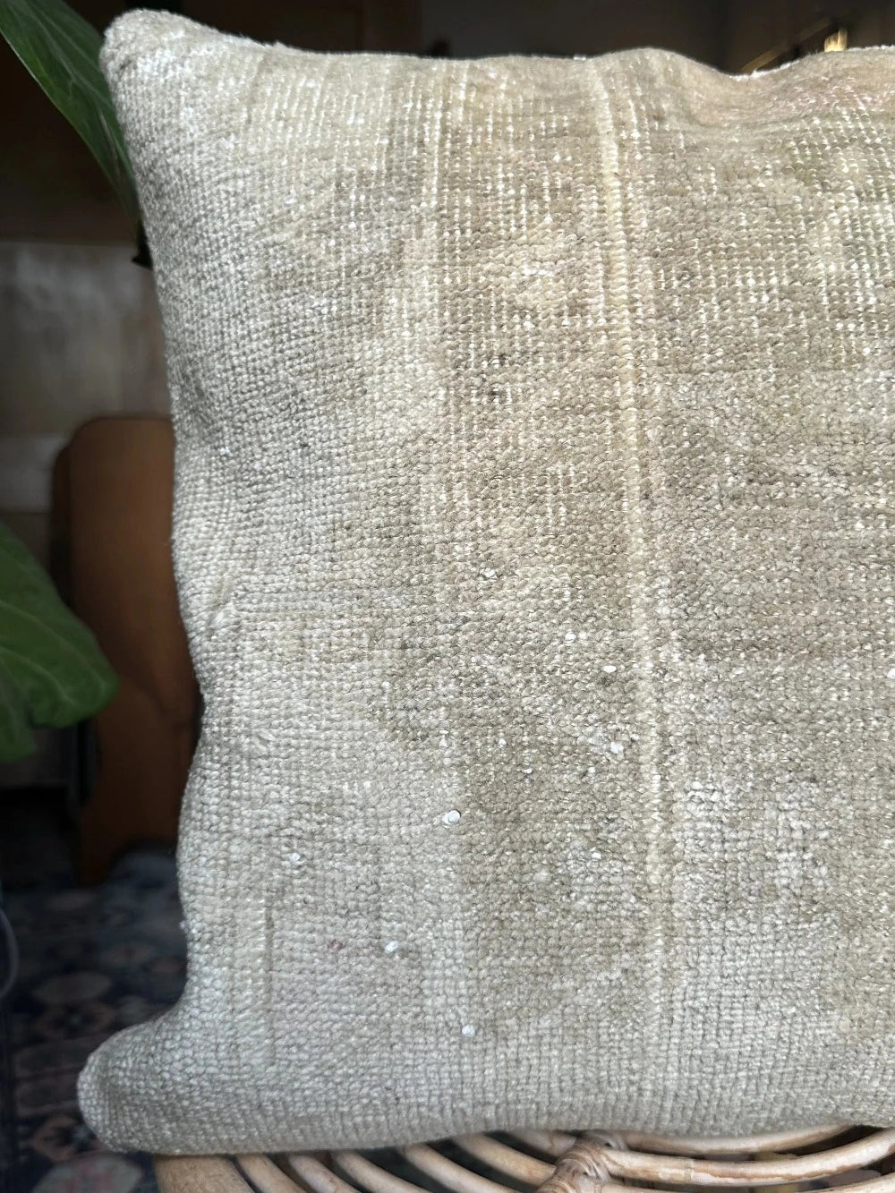18 by 18 neutral Turkish pillow made from old Turkish rugs, light red and pink coloring throughout but mostly white and light sand