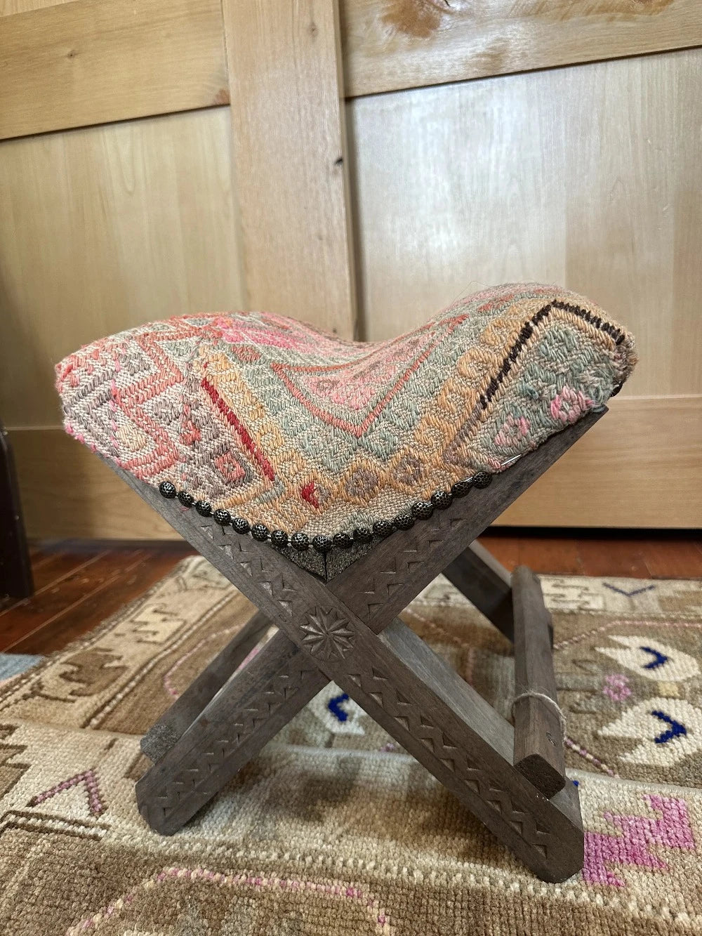 14 by 14 by 14 hand-carved Turkish tea house stools featuring recycled turkish rugs as seat covers