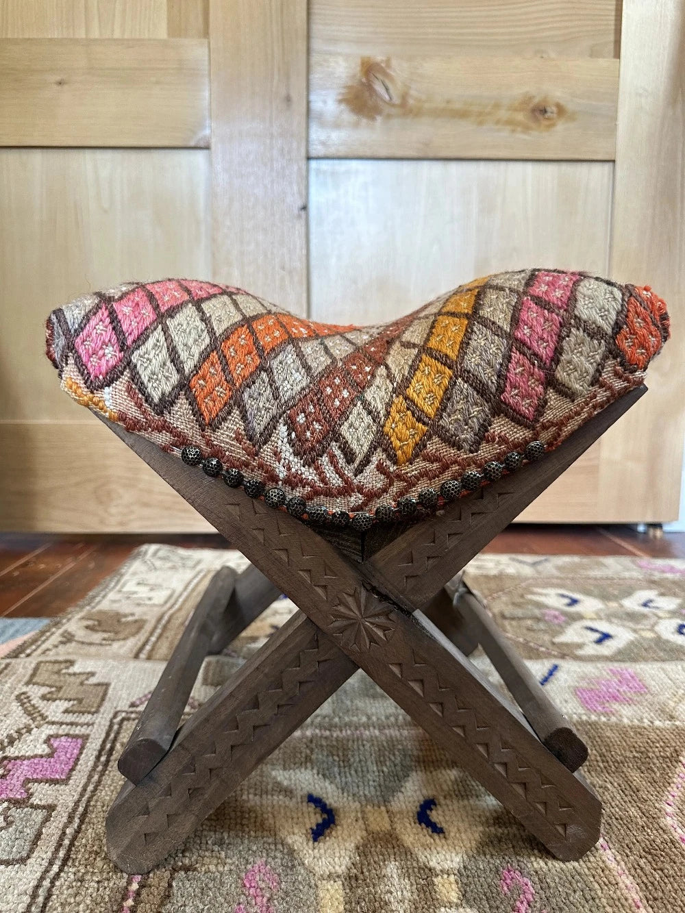 14 by 14 by 14 hand-carved Turkish tea house stools featuring recycled turkish rugs as seat covers