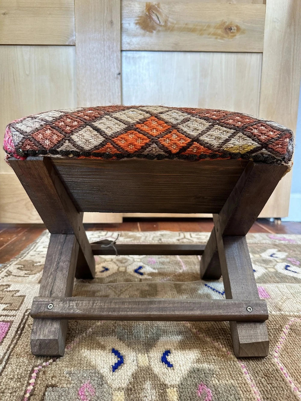 14 by 14 by 14 hand-carved Turkish tea house stools featuring recycled turkish rugs as seat covers
