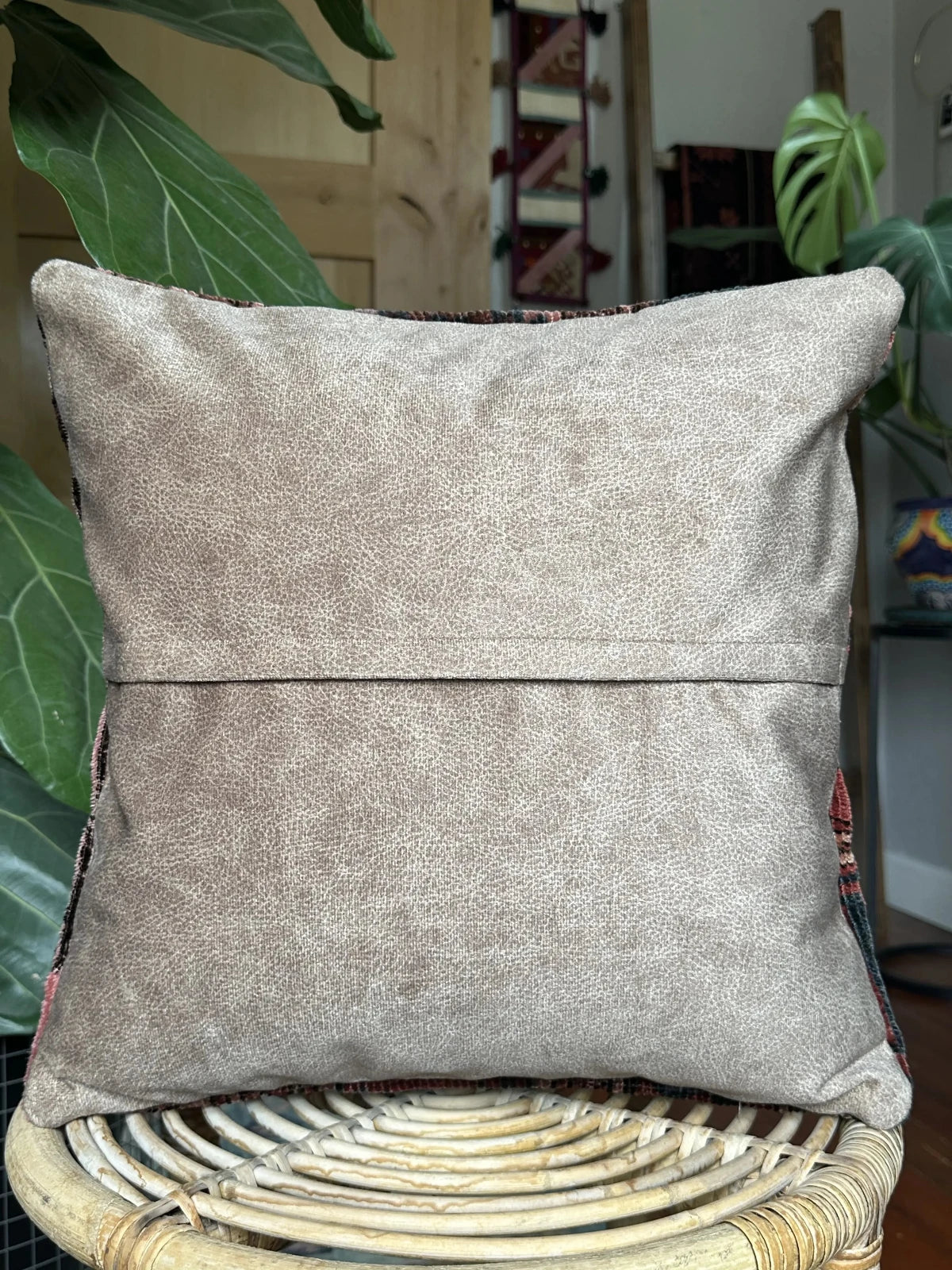 16 by 16 inch handmade Turkish throw pillow featuring a striped geometric pattern and coloring includes navy, merlot and baby pink