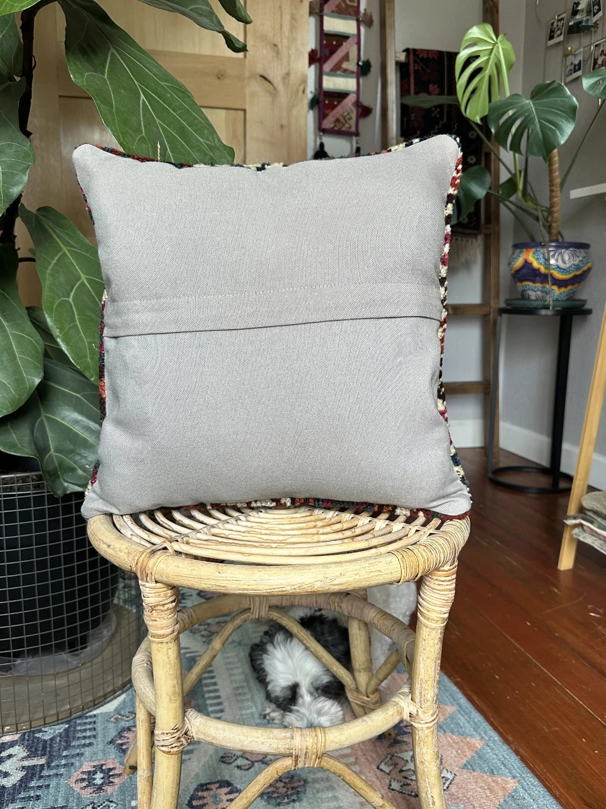 16 x 16 handmade Turkish throw pillow featuring geometric patterns throughout and dark navy and purple coloring with cream accent