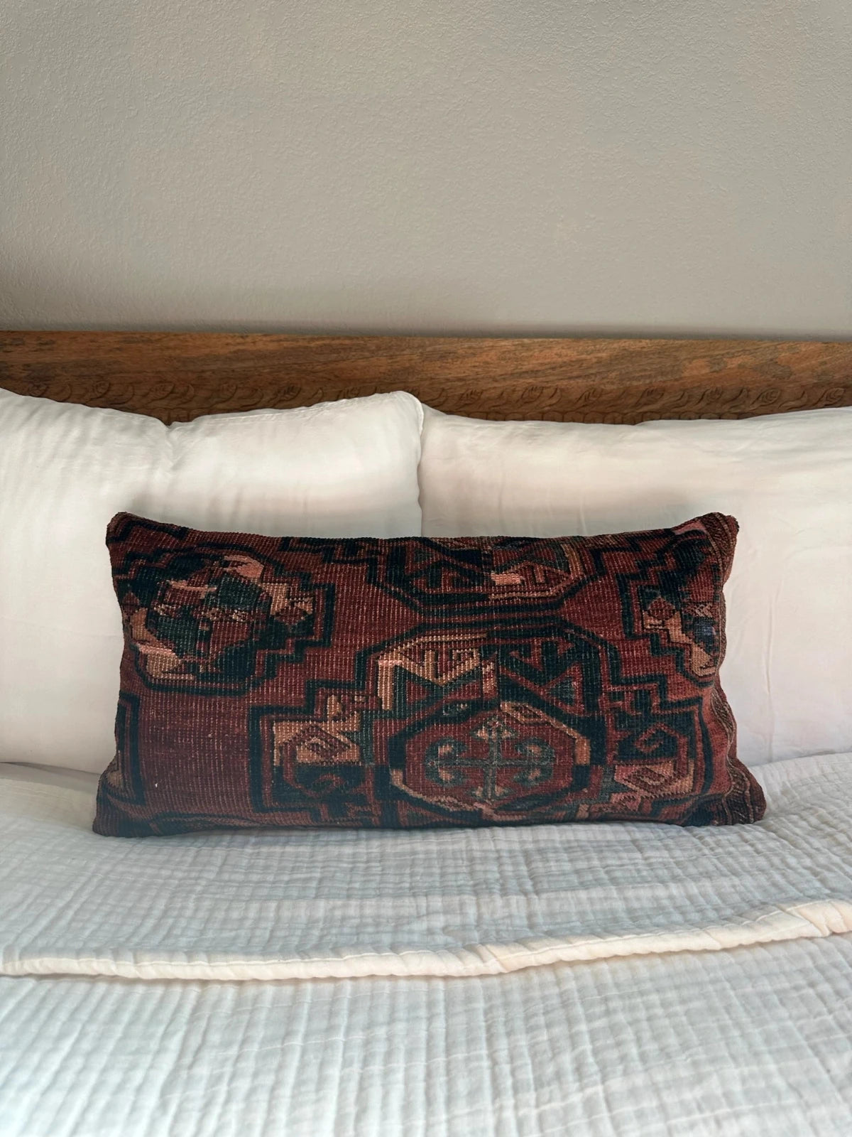 12 by 24 inch handmade Turkish lumbar pillows featuring a velvety soft pile and merlot red, pink and navy color palette.