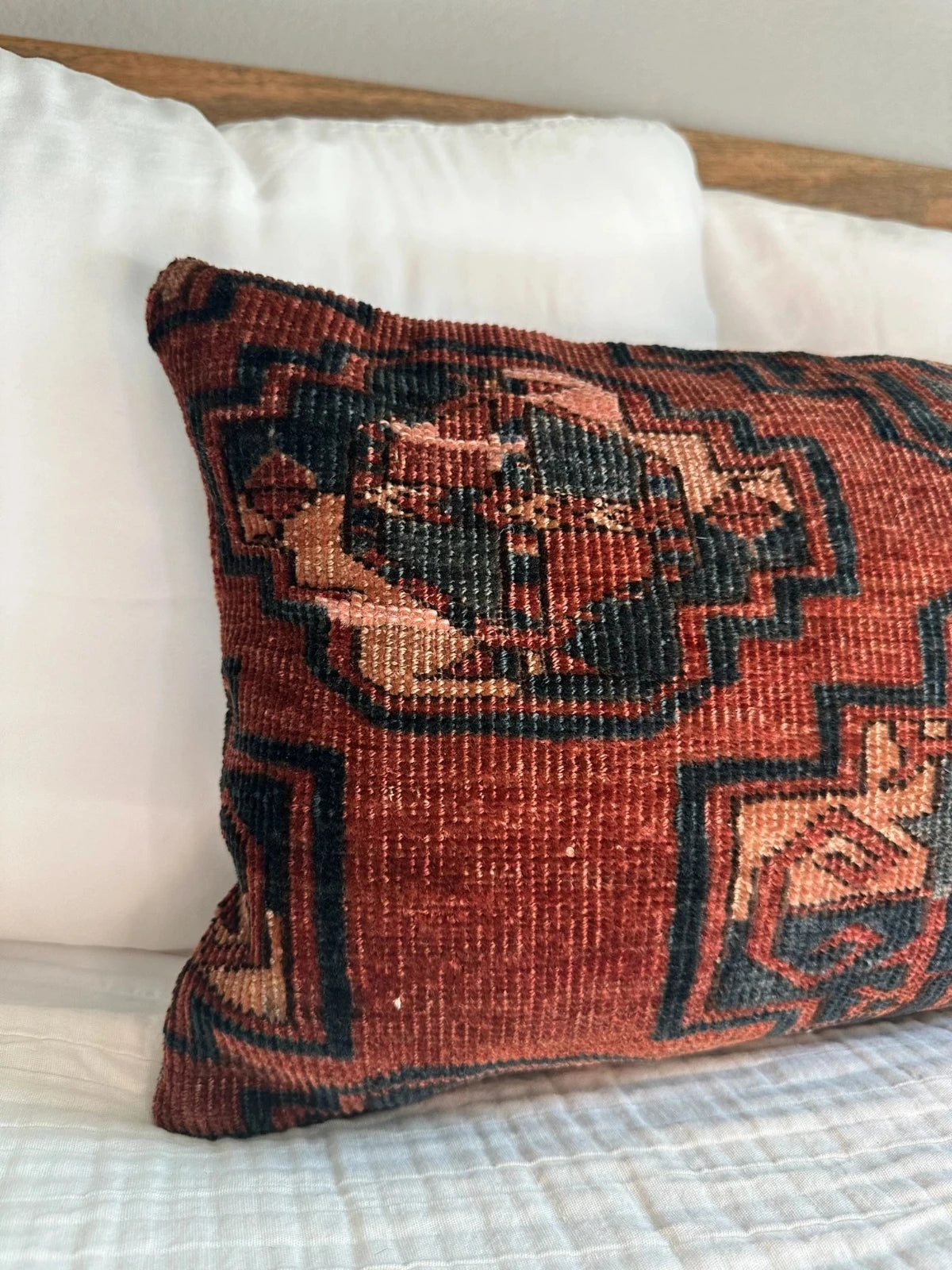 12 by 24 inch handmade Turkish lumbar pillows featuring a velvety soft pile and merlot red, pink and navy color palette.