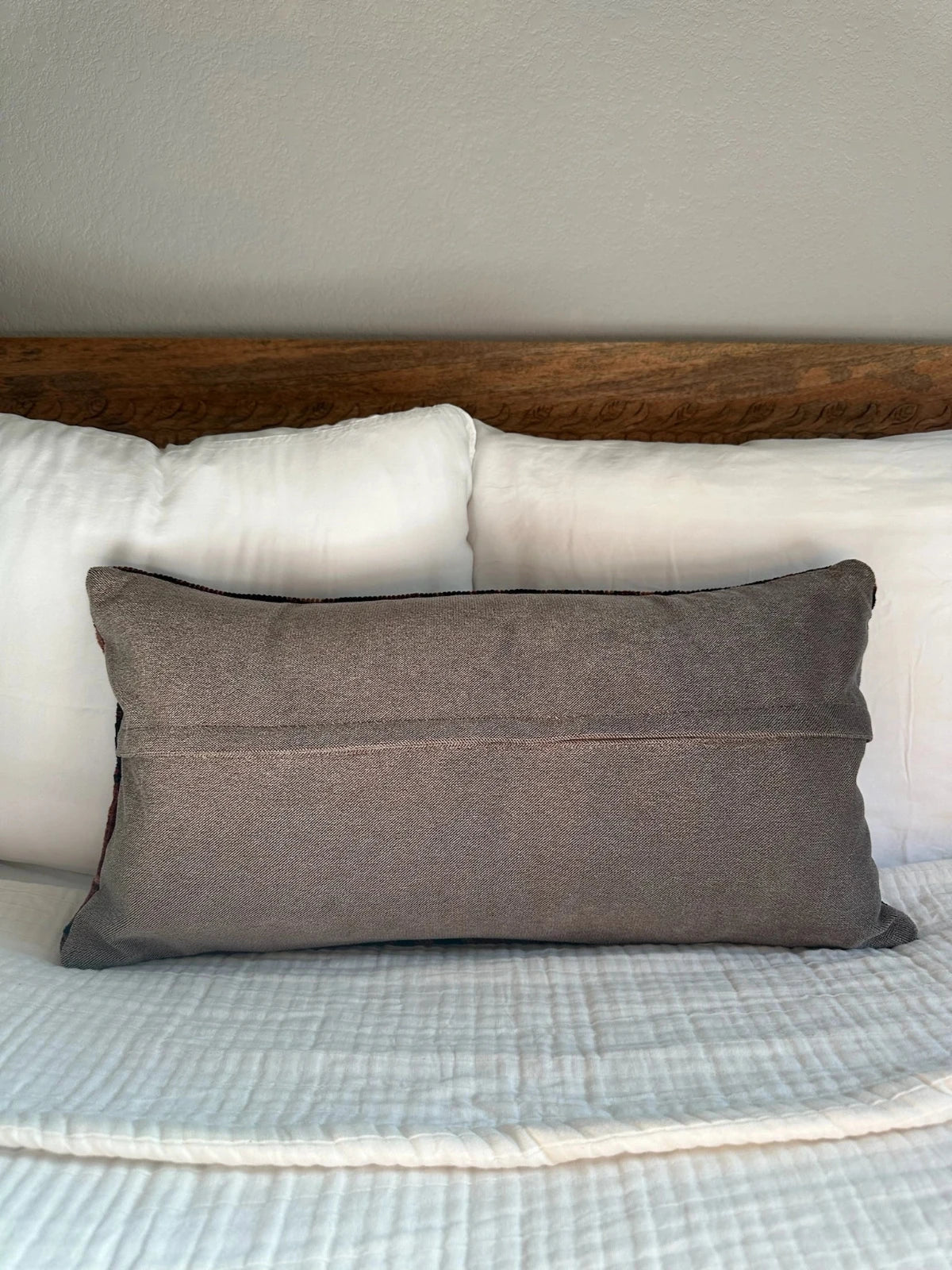 12 by 24 inch handmade Turkish lumbar pillows featuring a velvety soft pile and merlot red, pink and navy color palette.