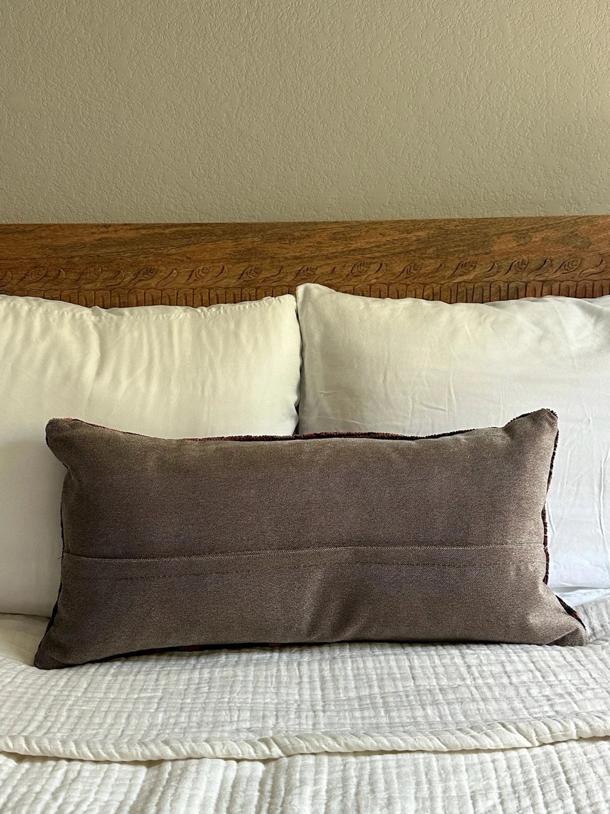 12 by 24 inch handmade Turkish lumbar pillows featuring a velvety soft pile and merlot red, pink and navy color palette.