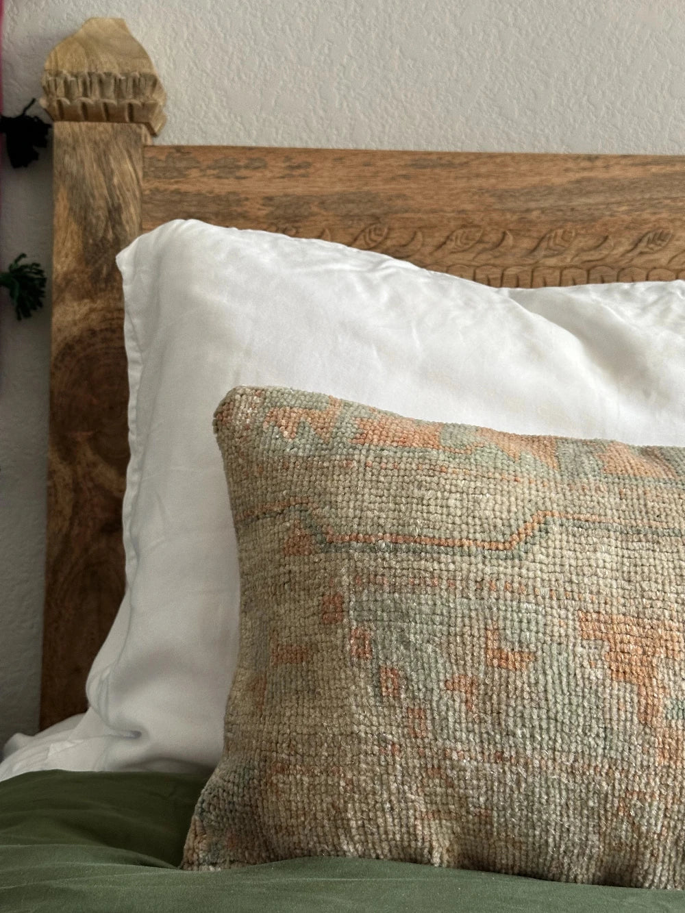 12 by 36 handmade Turkish lumbar pillow featuring floral and geometric designs and salmon, teal and sand coloring