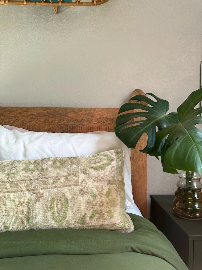 12x47 Turkish neutral lumbar pillow featuring warm neutral ones and pops of olive and light green