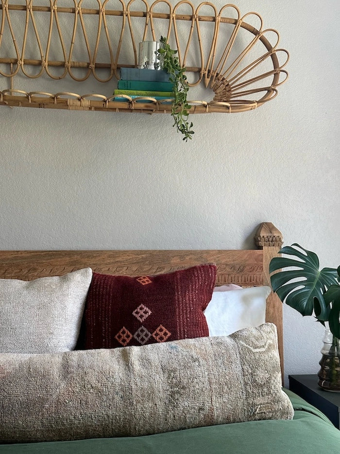 12x47 neutral lumbar pillow featuring tones of brown and tan with geometric designs