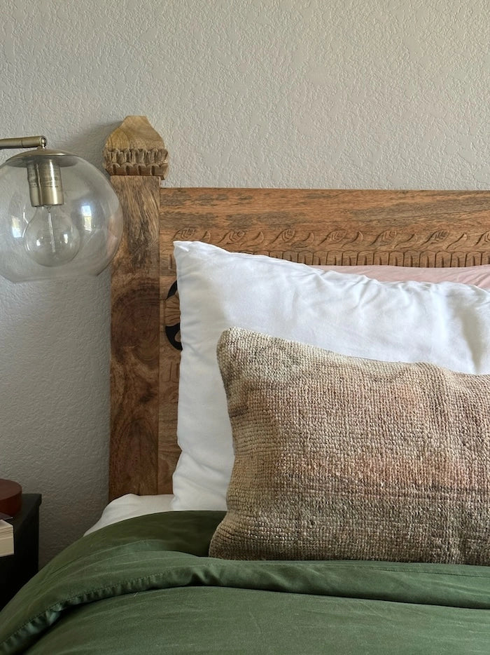 12x47 neutral lumbar pillow featuring tones of brown and tan with geometric designs