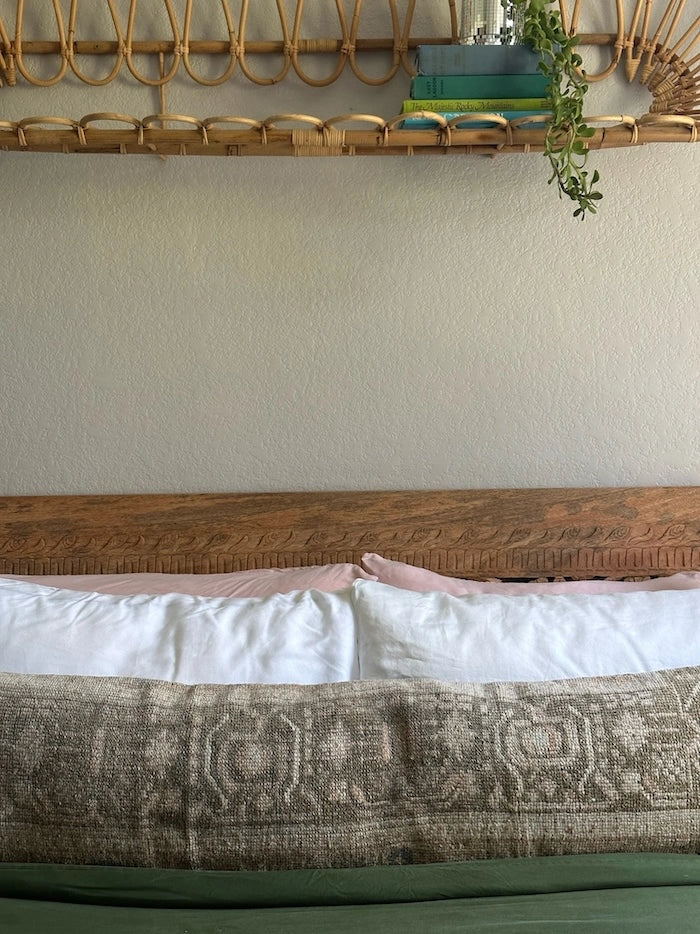 12x47 neutral Turkish lumbar pillow featuring rich brown and light tan tones and large geometric shapes across the front slightly zoomed in