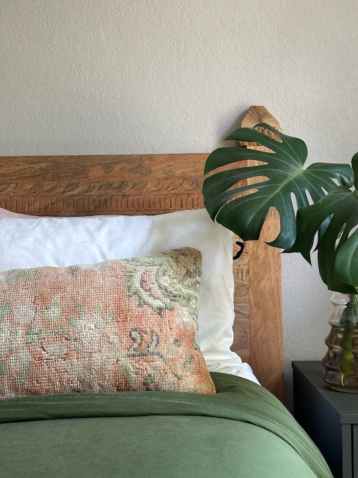 12x47 neutral Turkish lumbar pillow featuring sherbet orange coloring and pops of olive green