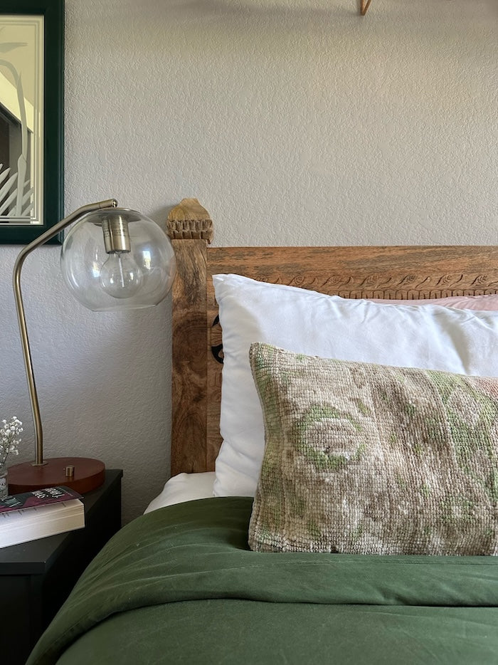12x47 neutral Turkish lumbar pillow featuring sherbet orange coloring and pops of olive green