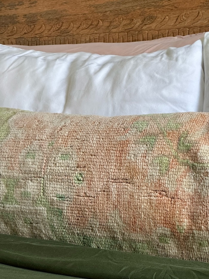 12x47 neutral Turkish lumbar pillow featuring sherbet orange coloring and pops of olive green