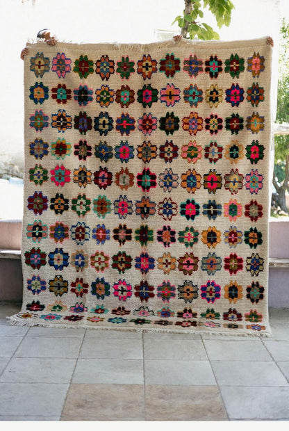 Colorful floral and geometric patterned rug 