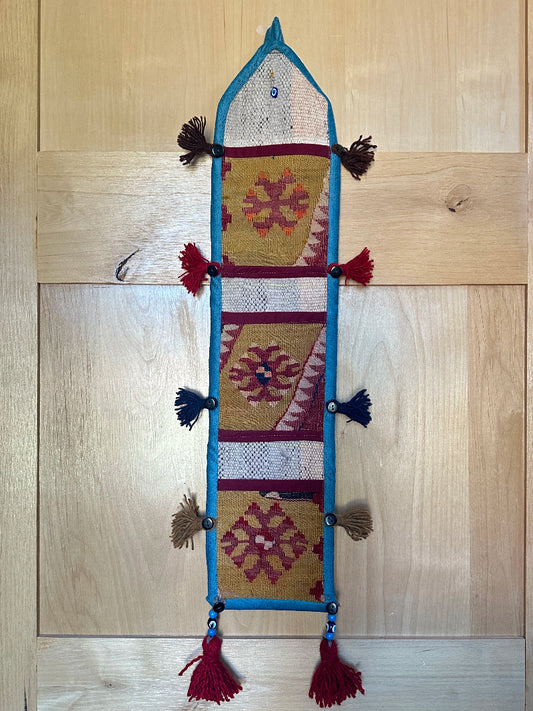 olive green, maroon and teal colored fabric 3 pocket wall organizer and accessory made from turkish rug fragments