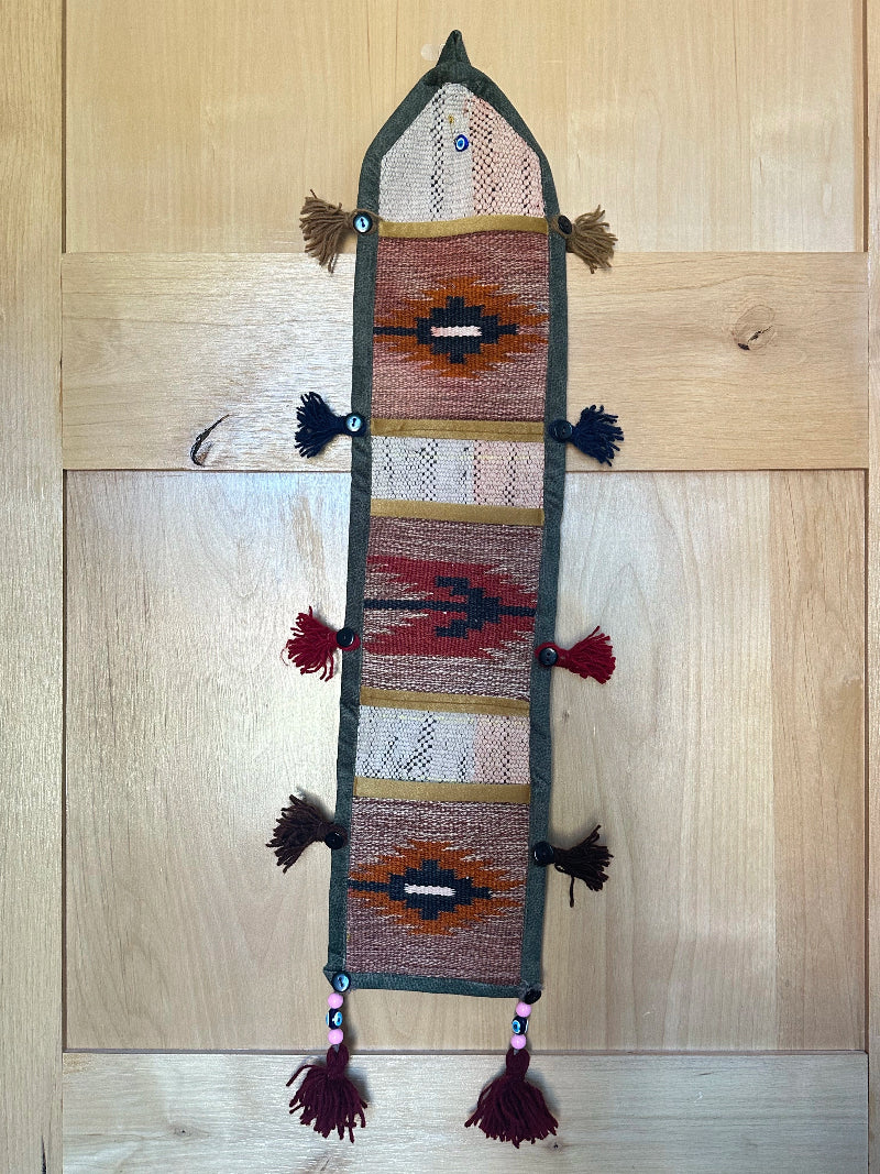 red, orange, and olive green colored fabric 3 pocket wall organizer and accessory made from turkish rug fragments