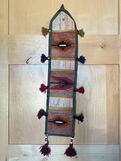 red, orange, and olive green colored fabric 3 pocket wall organizer and accessory made from turkish rug fragments