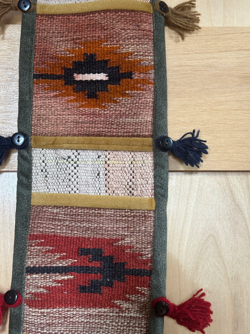 red, orange, and olive green colored fabric 3 pocket wall organizer and accessory made from turkish rug fragments