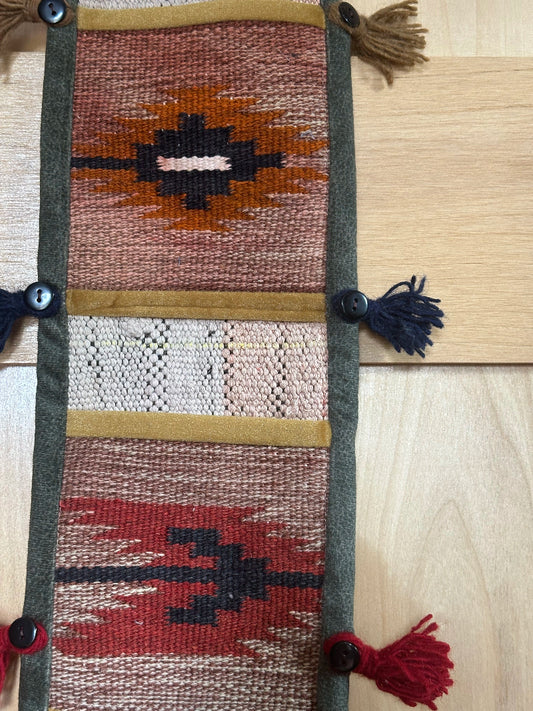 red, orange, and olive green colored fabric 3 pocket wall organizer and accessory made from turkish rug fragments