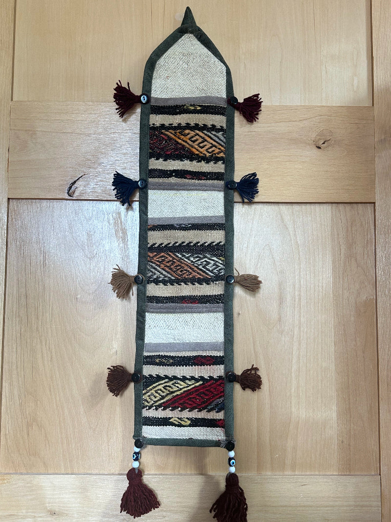 taupe, orange and olive green colored fabric 3 pocket wall organizer and accessory made from turkish rug fragments