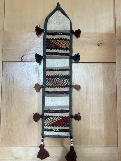 taupe, orange and olive green colored fabric 3 pocket wall organizer and accessory made from turkish rug fragments