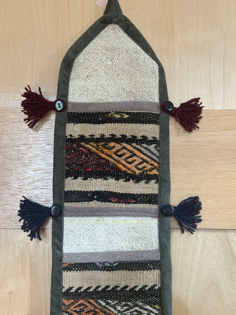 taupe, orange and olive green colored fabric 3 pocket wall organizer and accessory made from turkish rug fragments