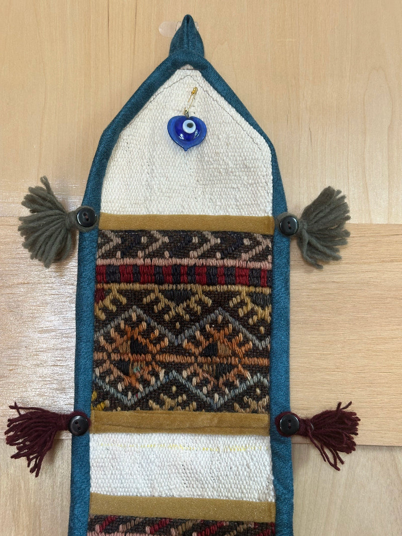 mustard, charcoal and teal colored fabric 3 pocket wall organizer and accessory made from turkish rug fragments